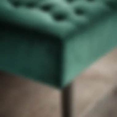 Close-up of the texture and material of an emerald green bedroom bench